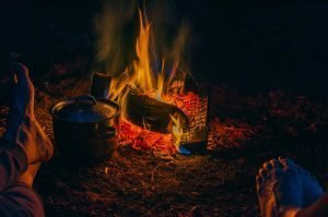 keeping feet warm near a campfire